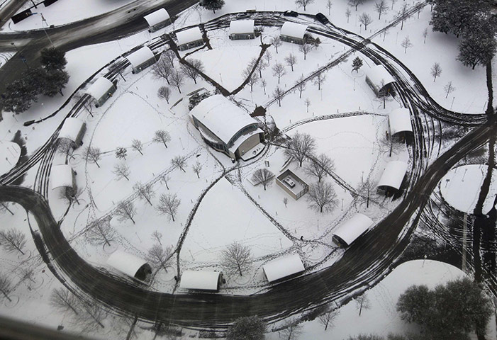 24 Hours: A deserted downtown transportation hub covered in snow