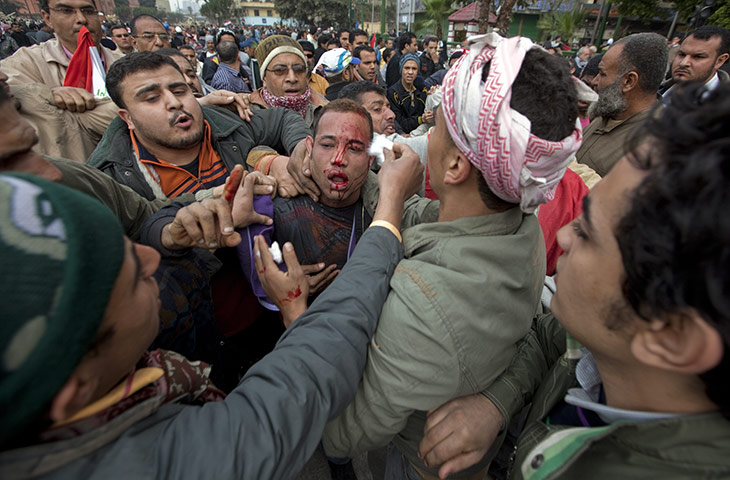 Sean Smith in Egypt: Feb 5: A man believed to be a government police officer is surrounded