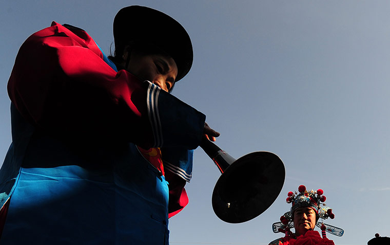 24 hours: Beijing, China: Participants in a procession honouring Confucius 