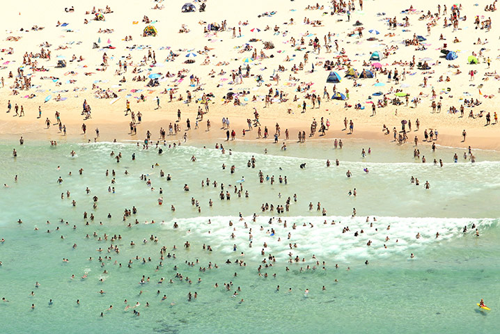 24 hours: Sydney, Australia: Aerial view of crowds escaping the heat at Bondi Beach
