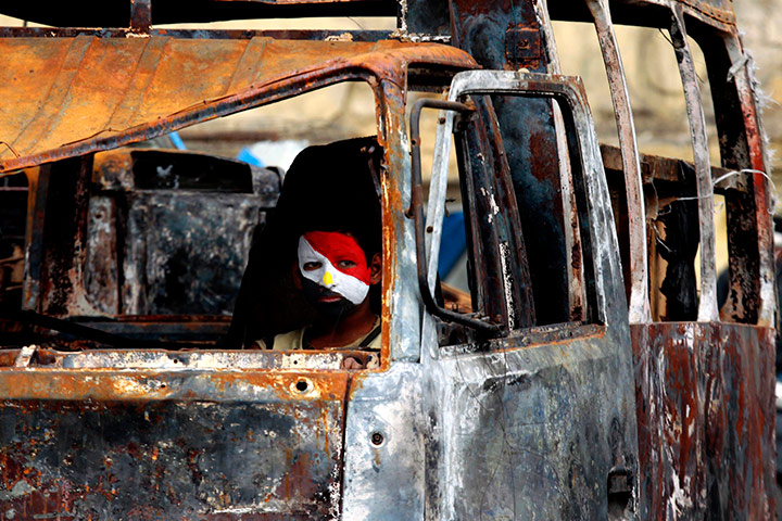 Egypt day 14: Egyptian with his face painted with the colours of the Egyptian flag