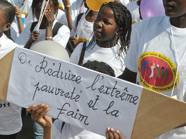 Social Forum: A protester holds a banner 