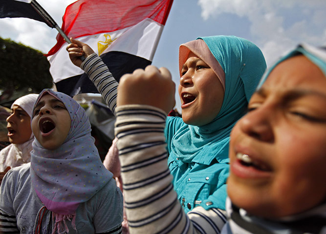 Egypt protests day 15: Children wave flags among opposition supporters near Tahrir Square