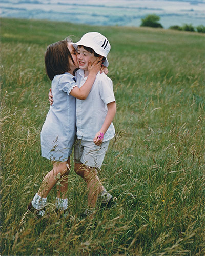 In pictures: affection: brother and sister in field