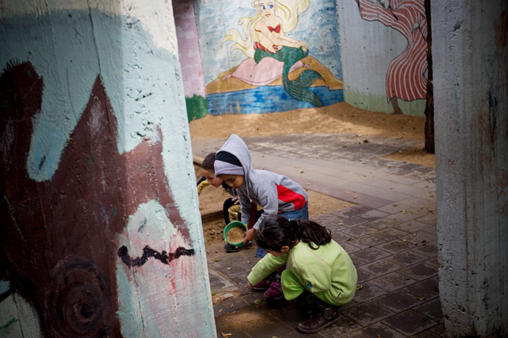 24 hours in pictures: Children of African migrants play in the yard, Israel