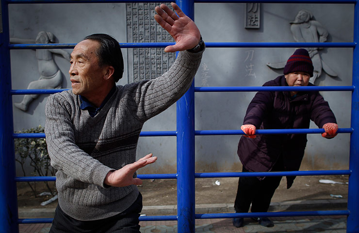 24 hours in pictures: Chinese elderly doing exercise at a public park in Beijing