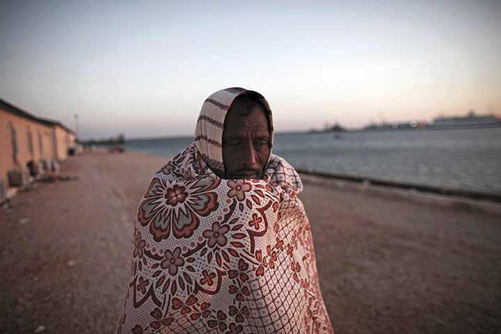 Libya: A Bangladeshi worker waits at the port in Benghazi