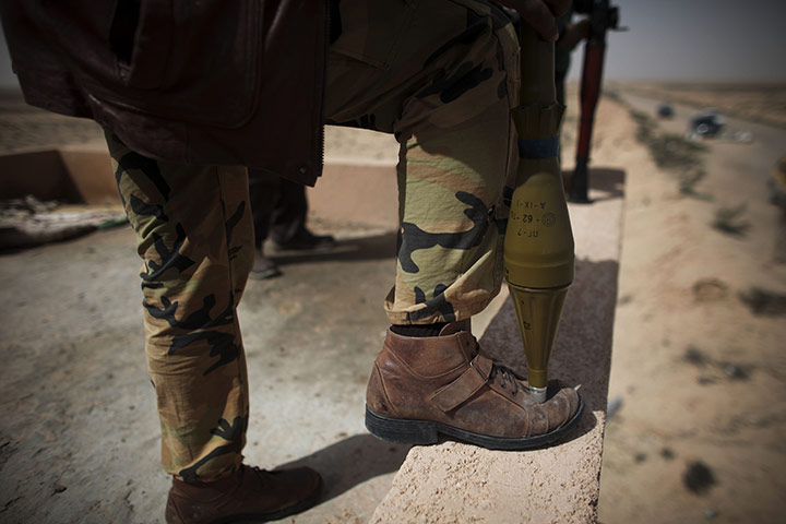 Libya: A revel militiaman with a rocket propelled grenade launcher