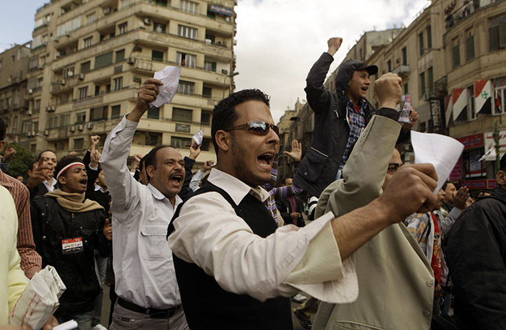 24 hours in pictures: Men chant slogans against protesters in Tahrir Square