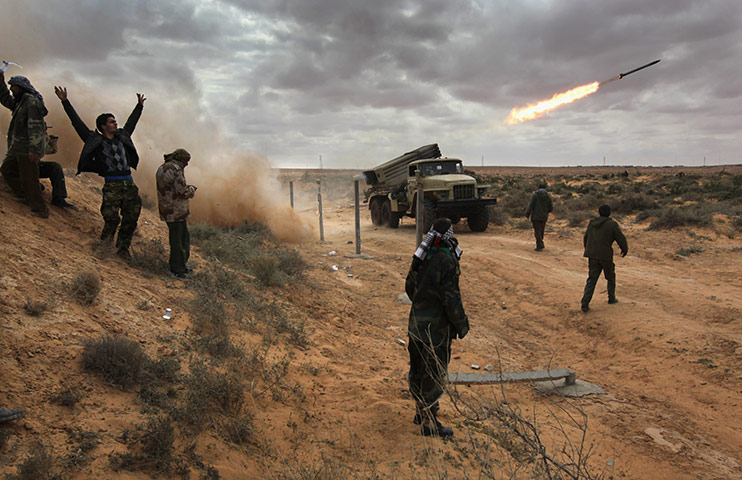 24 hours in pictures: opposition rebels battle gaddafi forces in eastern libya