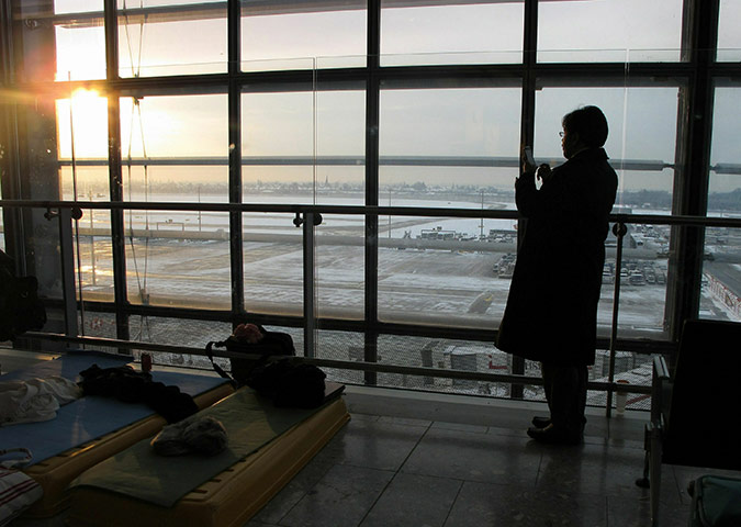 Week in business: A passenger takes a mobile phone picture at T5 at Heathrow Airport 
