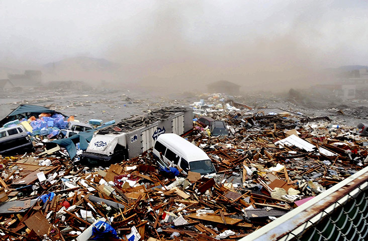 Japanese Earthquake: Cars swept away by tsunami tidal waves, Kesennuma, Miyagi Prefecture