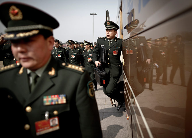 24 hours in pictures: A military officer gets out from a bus at National People's Congress, China