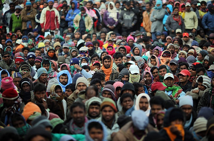 Ras Jdir Refugees: Men from Bangladesh wait patiently for information in Ras Jdir camp
