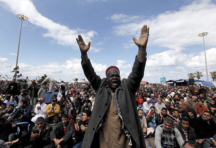 Benghazi Protests: An anti-Gadhafi protester shouts religious slogans