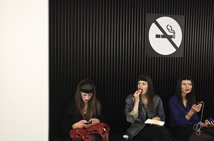 24 Hours in Pictures: Models wait backstage