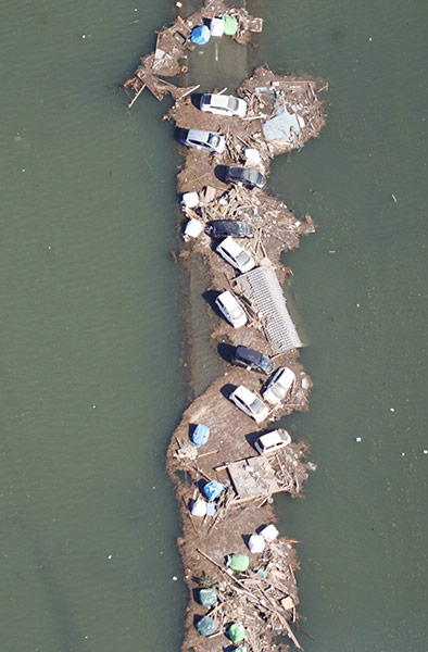 Japan - the day after: Vehicles in flood waters