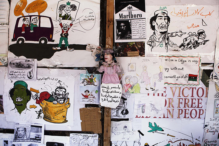 Libya unrest: caricatures of Muammar Gaddafi