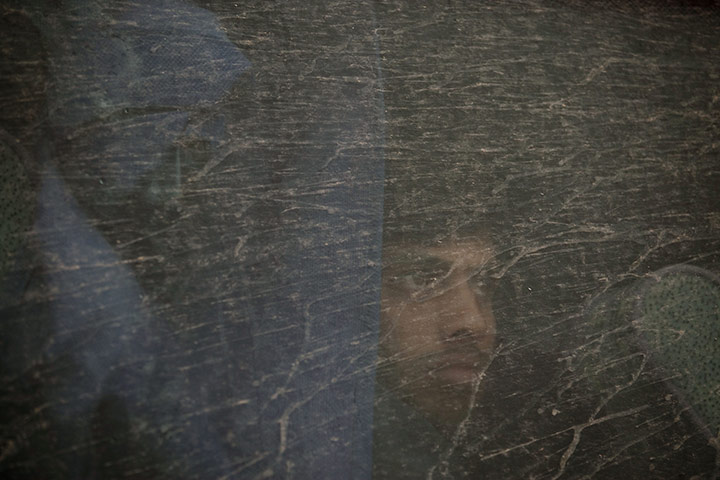 24 hours in pictures: A migrant worker from Bangladesh is taken away from the Libyan border 