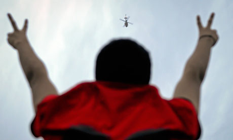 Bahraini protester flashes victory signs