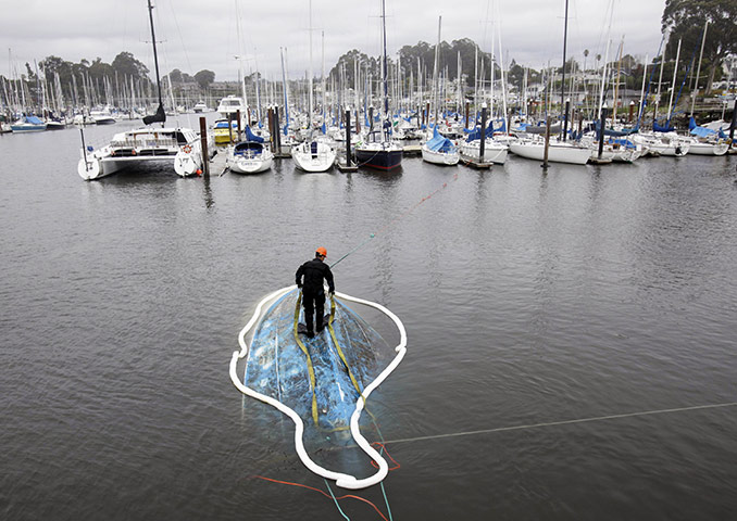 24 hours in pictures: capsized boat in Santa Cruz, USA