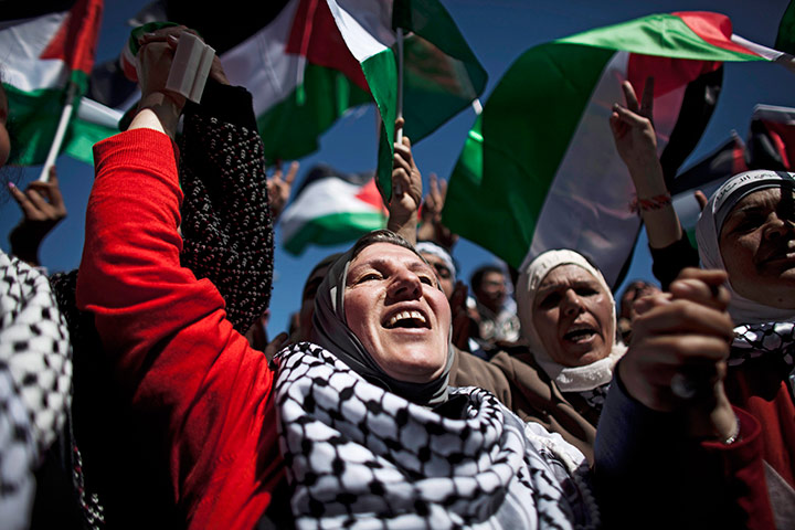 24 hours in pictures: Palestinian demonstrators shout slogans and wave Palestinian flags