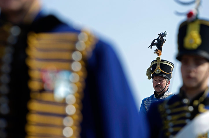 24 hours in pictures: Ethnic Hungarians wearing traditional Huszar uniforms