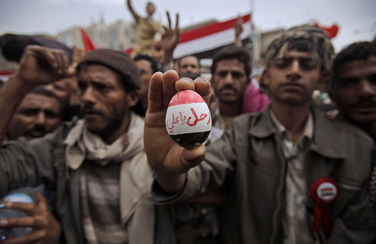 24 hours: Sana'a, Yemen: An anti-government protester holds up an egg