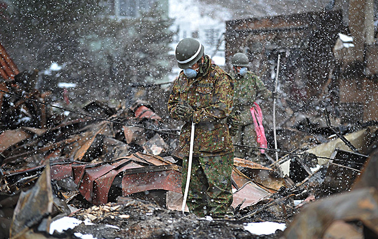 Japan aftermath: A Japanese soldier prays 