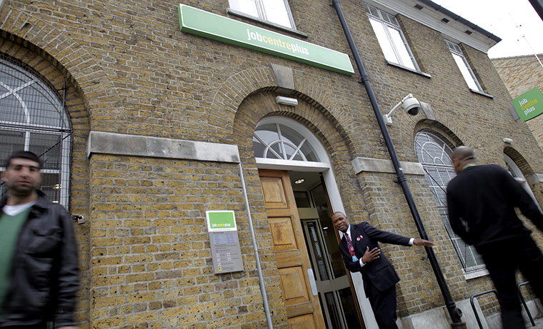 Week in Business: A security officer in front of a job centre in London