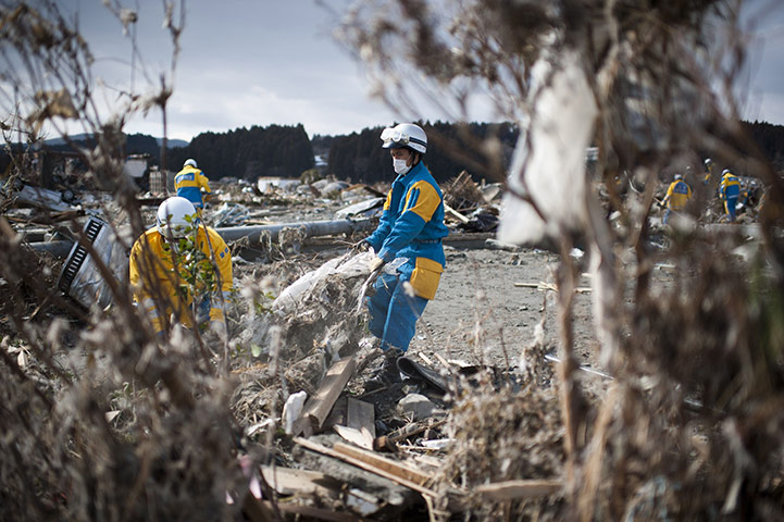 Japan Earthquake: Rescue workers search through debris in