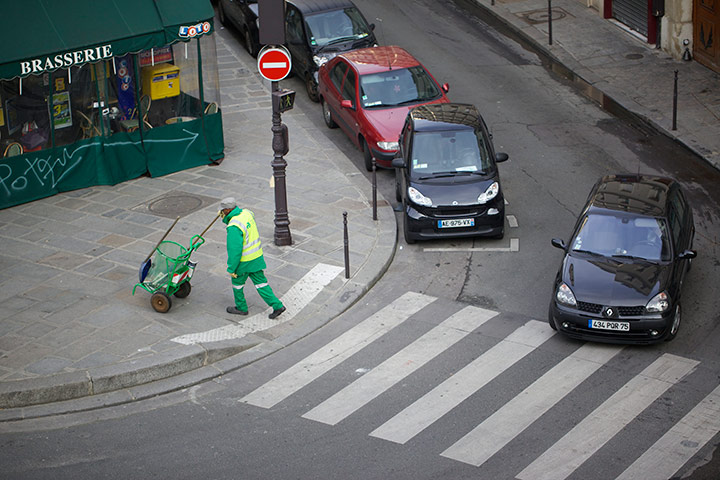 New Europe, France:  A street cleaner in 3rd Arrondissement, Paris, France
