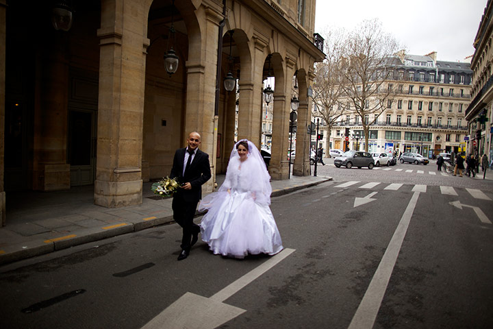 New Europe, France: A wedding couple walking through the streets, Paris, France