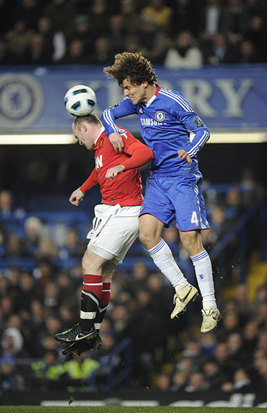 Chelsea v Man Utd: David Luiz crashes into the back of Rooney as they compete for a header
