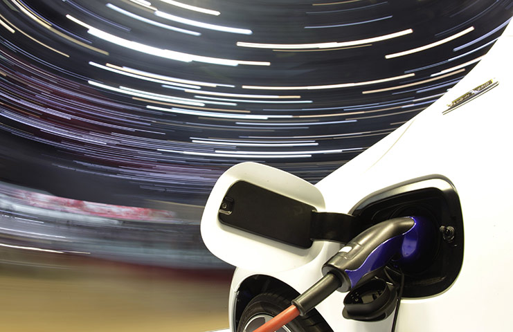 Geneva Motor Show: A V60 Volvo electric car is plugged to a charging station