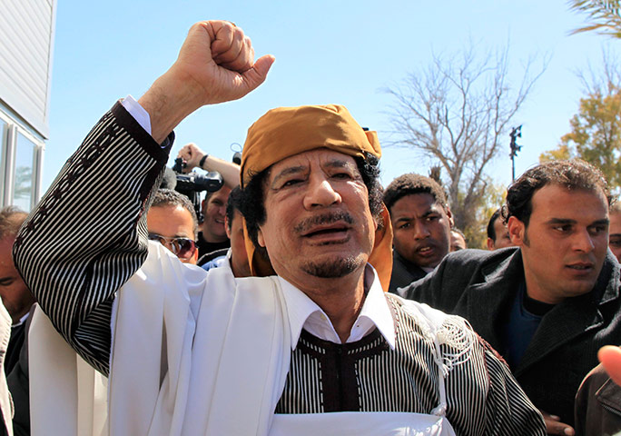 Libya: Libyan leader Muammar Gaddafi waves in Tripoli before making a speech