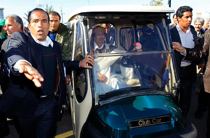 Libya: Gaddafi drives his personal cart through Tripoli