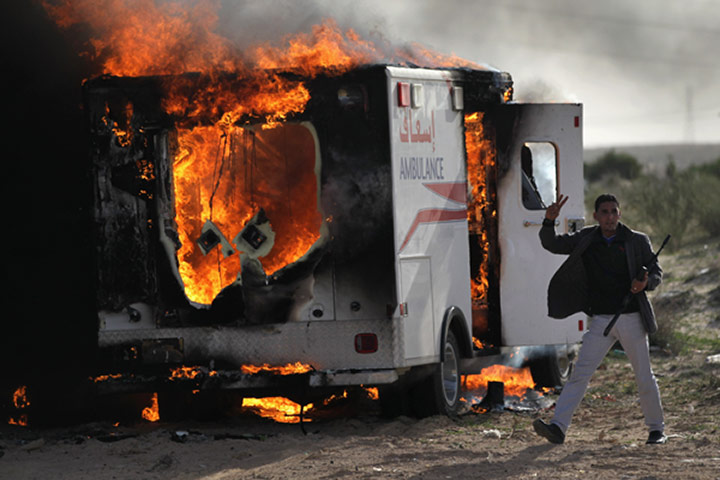 Libya unrest continues: A rebel fighter advances on the front line 