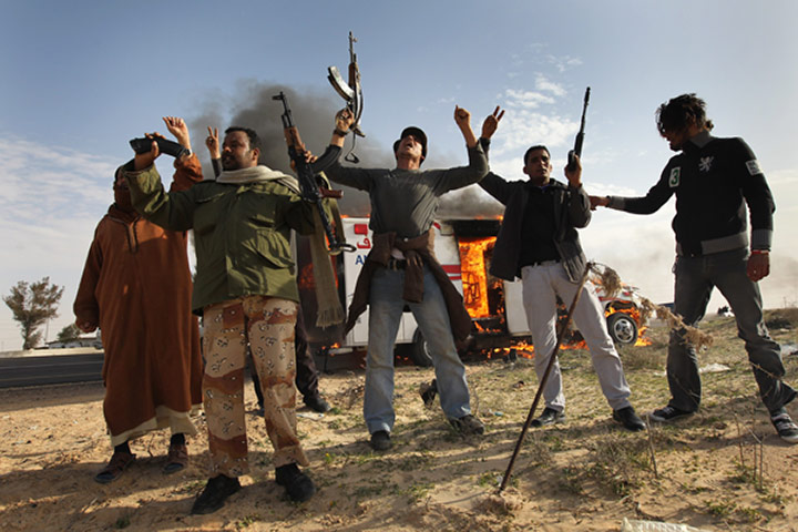 Libya unrest continues: Rebel fighters celebrate after advancing