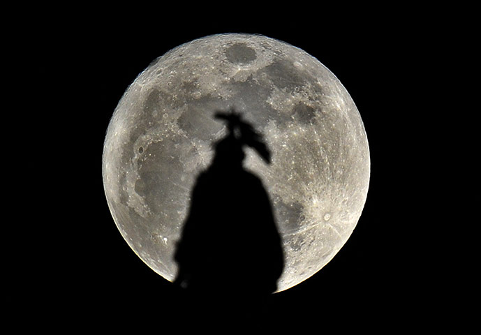 Super moon: The statue of freedom, on top of the US Capitol Hill 