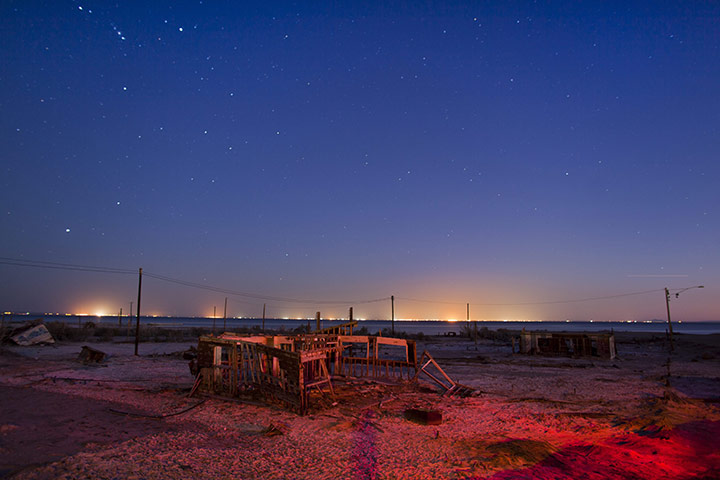 FTA: Jim Lo Scalzo  : An abandoned building sits in a salt pan near Bombay Beach