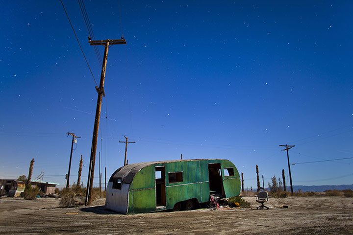 FTA: Jim Lo Scalzo  : An abandoned trailer is lit by a full moon