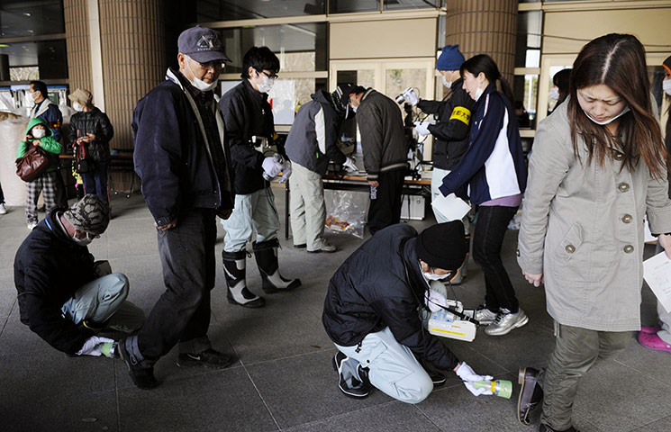 Japan survivors: Residents are checked for radioactivity levels in Fukushima City