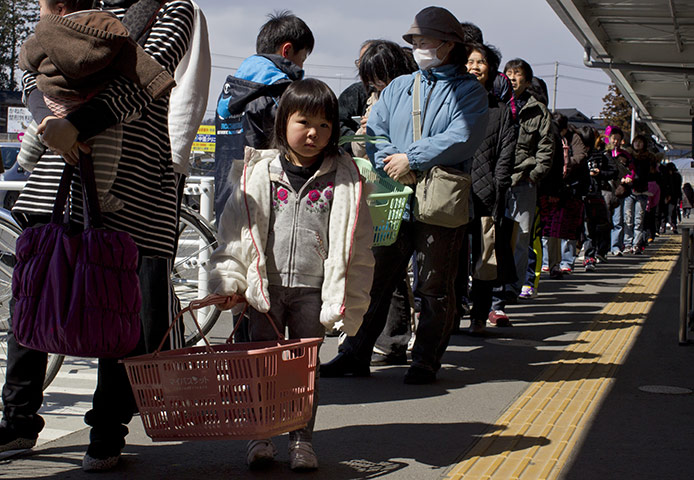 Japan survivors: Japanese wait in line for a supermarket, Ichinoseki, Japan