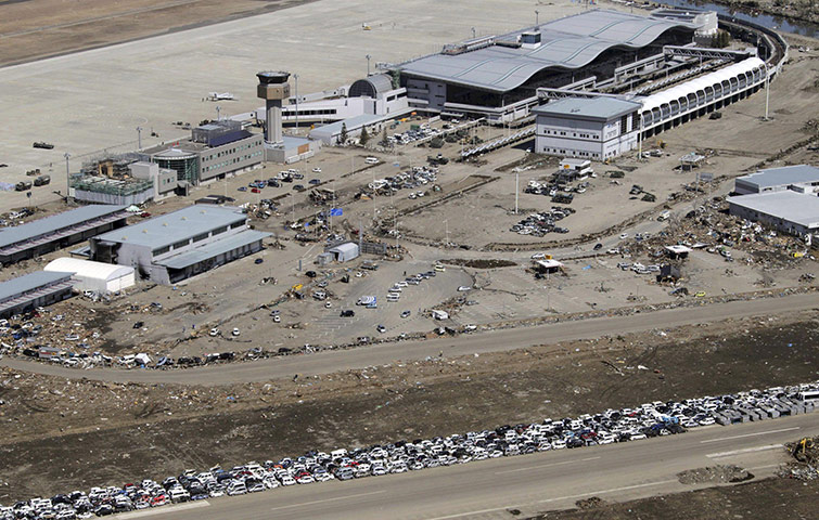 Japan aftermath: Destroyed vehicles at Sendai airport