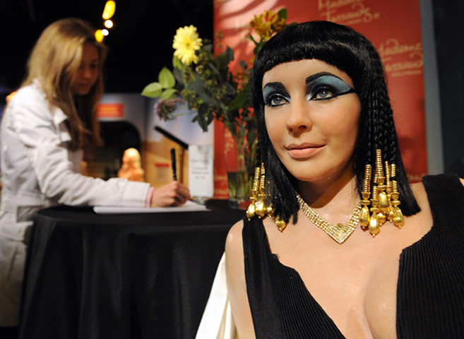 Elizabeth Taylor tribute: A woman signs a condolence book beside a