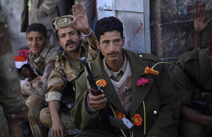 24 hours: Sana'a, Yemen: Yemeni army soldiers receive flowers from demonstrators