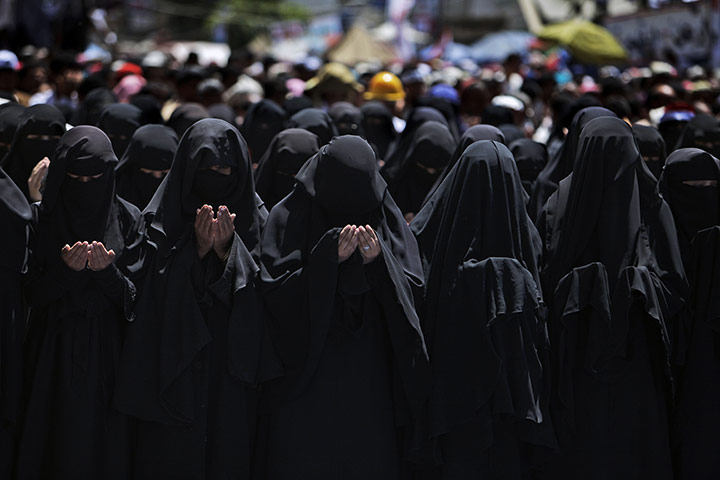 Yemen protests: female anti-government protesters pray during a demonstration