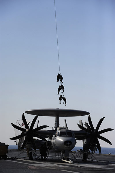 24 Hours: French soldiers are winched down from a helicopter on an aircraft carrier