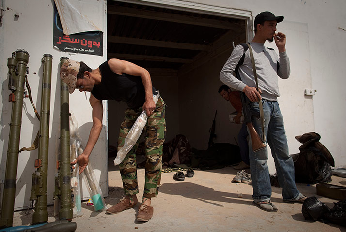Eastern Libya: Libyan rebels clean up a checkpoint in the outskirts of Ras Lanuf